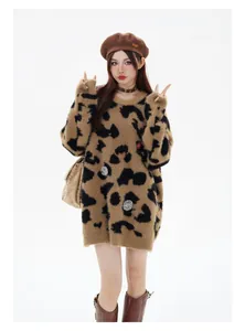 Full view of oversized leopard print mohair sweater with badge details on model