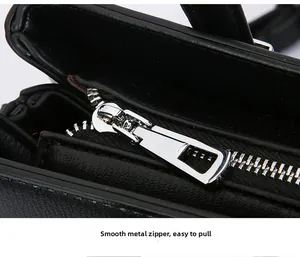 Close-up view of the smooth silver hardware zipper detail on a black commuter tote bag