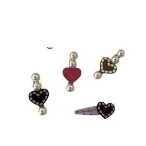 Set of cute and sweet colorful heart pearl hair clips and BB clips for girls hair styling.