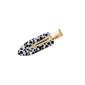 Stylish leopard print acetate acrylic hair clip featuring a golden metal duckbill base