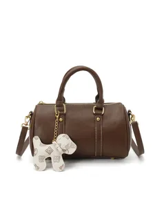 Elegant brown Boston pillow handbag for women featuring a cute dog-shaped charm accessory