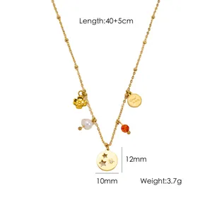 Detailed gold necklace featuring star, pearl and flower charms, length 40+5cm total