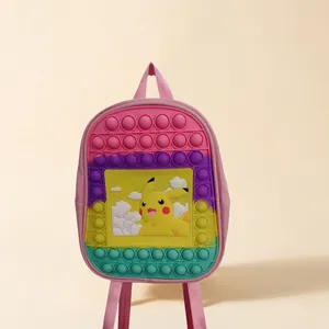 Detailed view of pink silicone pop-it backpack for kids with yellow cartoon character