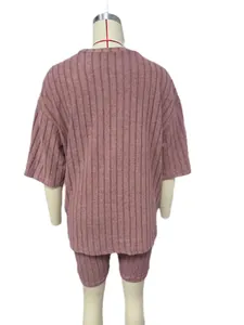 Back detail view of a mauve ribbed knit two-piece shorts set for women on a mannequin.