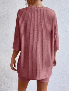Back view of women's ribbed knit lounge set in dusty rose with loose T-shirt and shorts