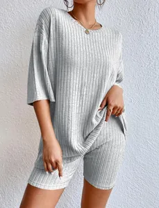 Close-up detail of a light gray ribbed two-piece summer set with loose round neck top