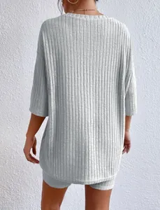 Back view of a comfortable light grey ribbed summer two-piece lounge set for women