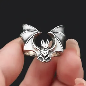 Close-up of retro stainless steel bat ring with detailed wings and vintage finish