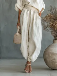 Elegant beige linen cotton two-piece set with loose top and high-waist lantern pants