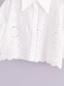 White eyelet embroidered cropped shirt featuring a lapel collar and scalloped hem
