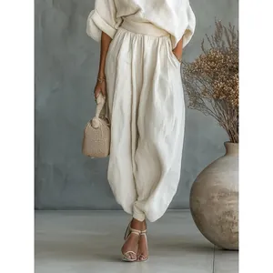 Elegant white cotton linen lounge set featuring loose top and stylish lantern pants