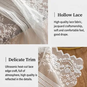 White French lace table runner featuring hollow floral patterns and elegant scalloped edges