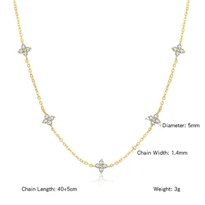 Macro view of 18K gold plated titanium steel clover necklace with zircon stones