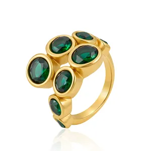 Detailed macro view of 18K gold plated stainless steel ring with green zircon stones