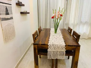Boho style hand-woven macrame table runner with elegant tassels for dining table decor