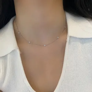 Minimalist stainless steel four-leaf clover necklace with cubic zirconia for women.