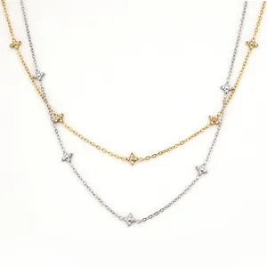 Elegant gold and silver four-leaf clover necklaces with shimmering zircon stone accents