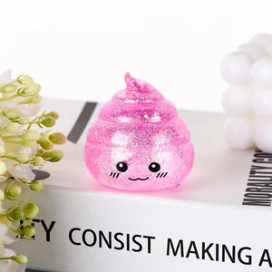 Detailed close-up of a pink glittery poop squeeze toy featuring a cute smiling face