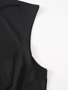 Detailed close-up of the pocket and armhole stitching on a black men's casual T-shirt.