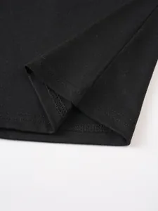 Detailed macro view showing high-quality double-stitched hem on men's black casual cotton T-shirt