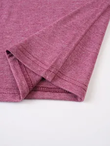 Macro detail of the double-stitched hem on a casual purple melange cotton T-shirt