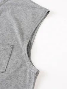 Close-up macro detail of grey sleeveless T-shirt showing armhole and pocket stitching