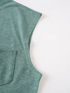Detailed view of heather green men's T-shirt pocket and fabric texture quality.