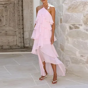 Elegant light pink ruffled halter maxi dress with an irregular hem for summer resort