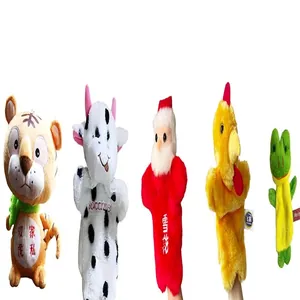 Detailed view of various animal plush hand puppets including tiger and cow for storytelling.