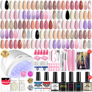 Kit nail art professionale con lampada UV, gel colorati e set di accessori.