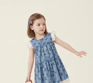 Detailed view of sweet girls sleeveless blue bow print tiered cake dress with delicate lace trim