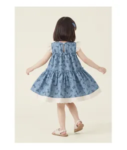 Back view of girl's blue sleeveless dress with bow print and white lace trim detail