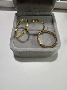 Macro view of gold-plated stainless steel rings with engraved angel numbers 111 222 333