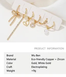 Detailed close-up of fashion earring set featuring bow, heart, tassel, and pearl elements