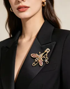 Elegant gold-tone bee brooch with colorful enamel wings and honeycomb charm detail for women