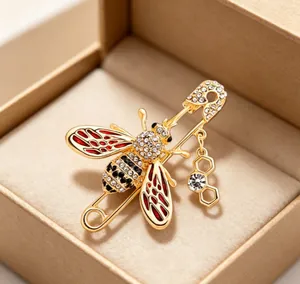Exquisite detailed macro view of an enamel bee brooch with rhinestones and a honeycomb charm