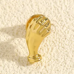 Elegant gold hand-shaped bouquet brooch pin with a polished finish and creative design