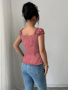 Detailed back view of an elegant red and white striped short sleeve top with ruffle hem