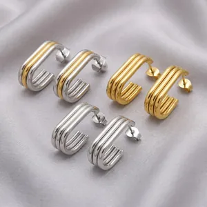 Detailed macro shot of oval multi-layer 18K gold plated stainless steel earrings