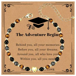 Graduation gift tiger's eye beaded bracelet with gold heart charm on greeting card