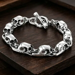 Men's gothic skull link bracelet crafted from vintage silver titanium steel on wood