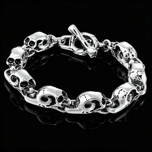 Bold men's stainless steel skull bracelet featuring a vintage gothic toggle clasp design