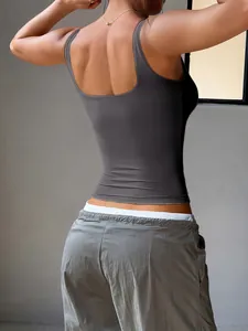 Back view of a women's slim-fit grey yoga tank top showing fabric texture
