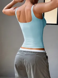 Detailed back view of a slim fit light blue yoga tank top for women in a lifestyle setting