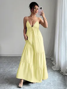 Elegant yellow tiered maxi dress with spaghetti straps and a deep V-neck design