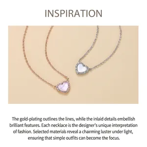 Detail view of heart-shaped necklaces with pink and white shell inlays and crystals
