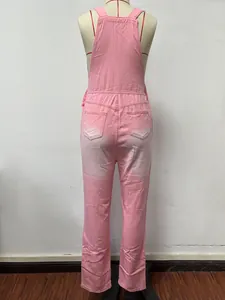 Back view of classic pink denim dungarees in soft pink with back pockets on a mannequin