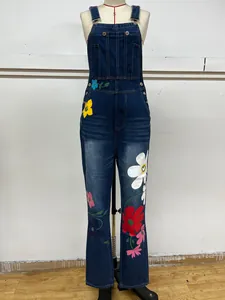 Classic blue denim overalls featuring vibrant floral prints and a stylish flare leg
