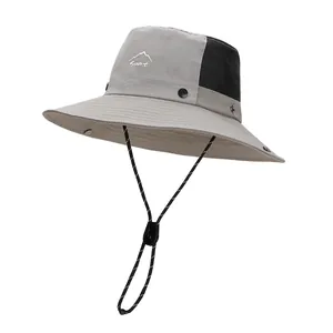 Grey outdoor bucket hat with wide brim and adjustable chin strap for women