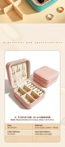 Close-up of open pink jewelry organizer showing compartments for rings and necklaces.